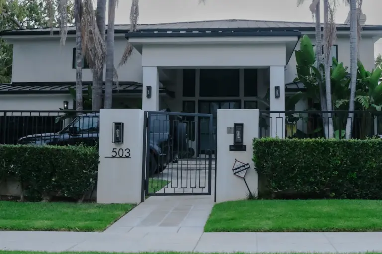Residential entrance with a secure driveway gate