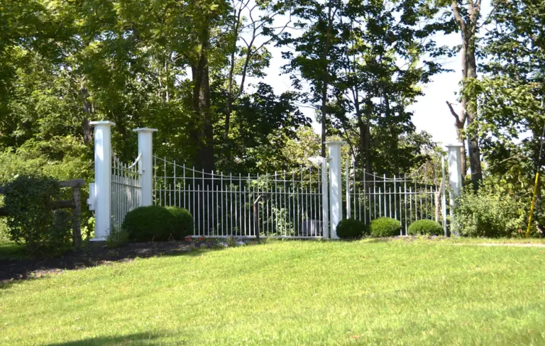 Metal security gate and perimeter fencing