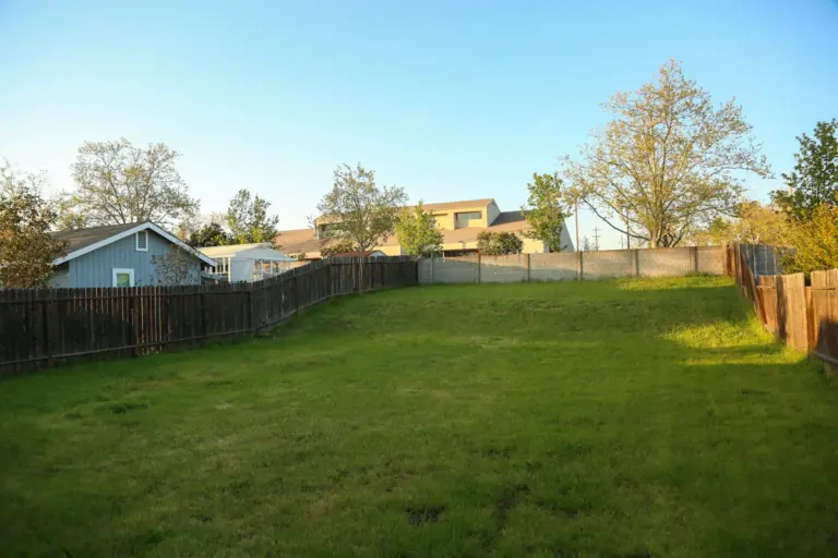 Wood privacy fence around a residential backyard