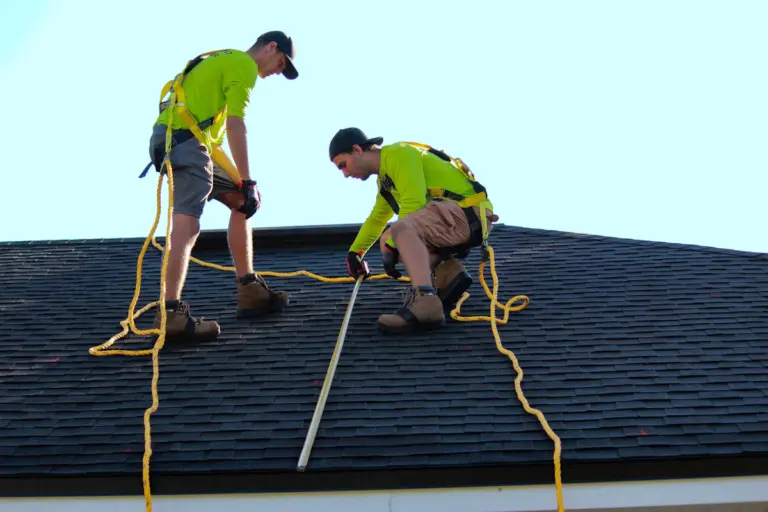 Roofing professionals working on a residential roof